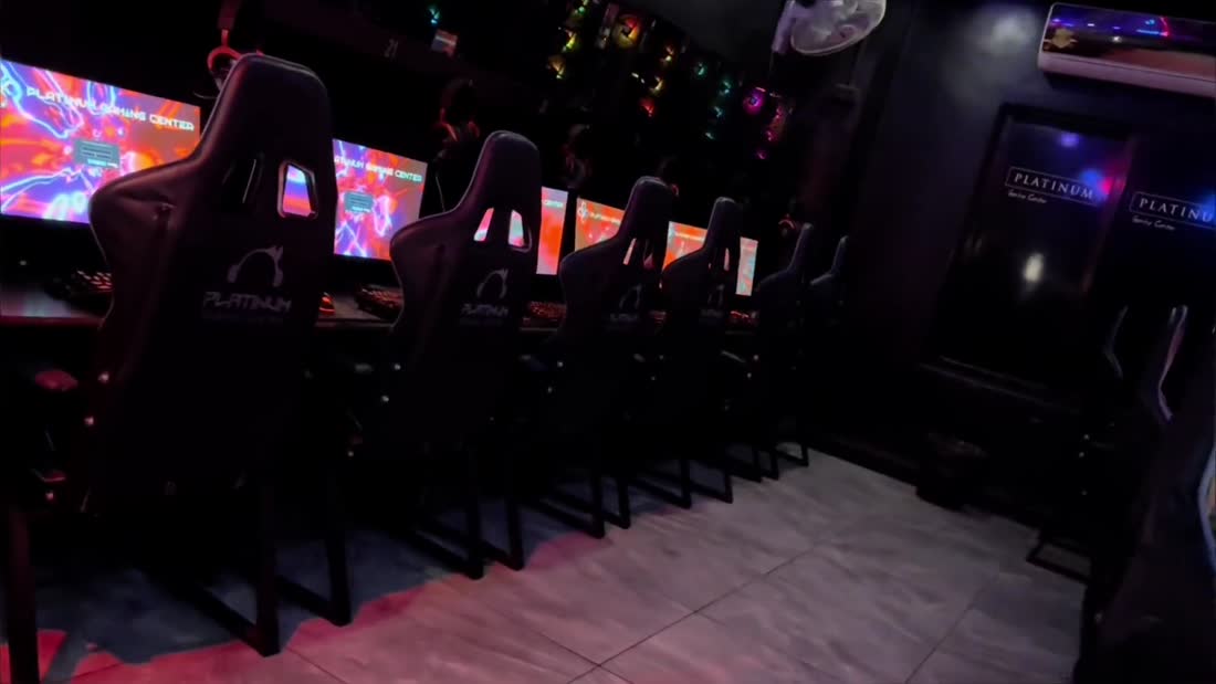 Rows of gaming chairs and screens
